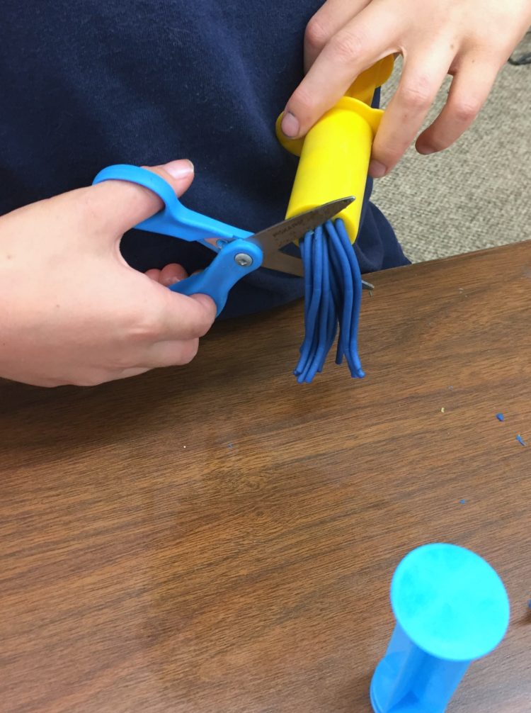 Fine Motor Work Stations In Action in Kindergarten-Play-doh Extruders