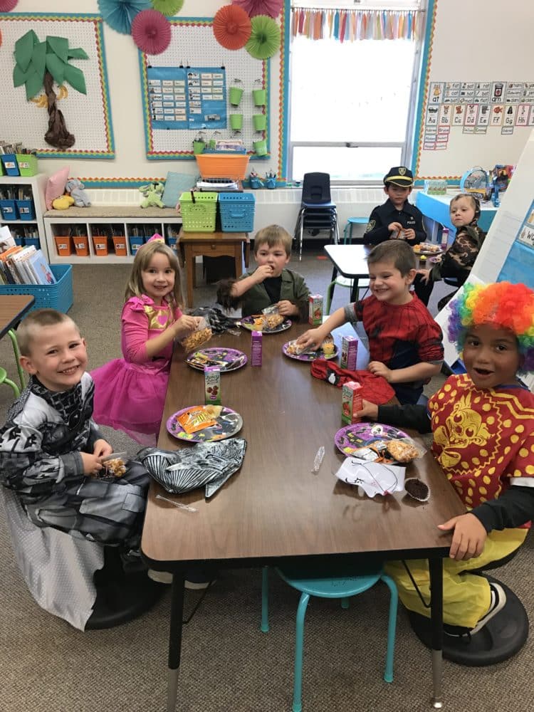 Students dressed up in costumes at Halloween party.
