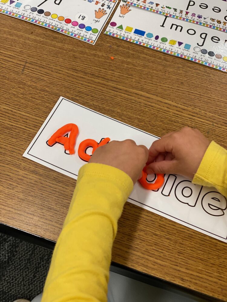 Writing names with play-doh.