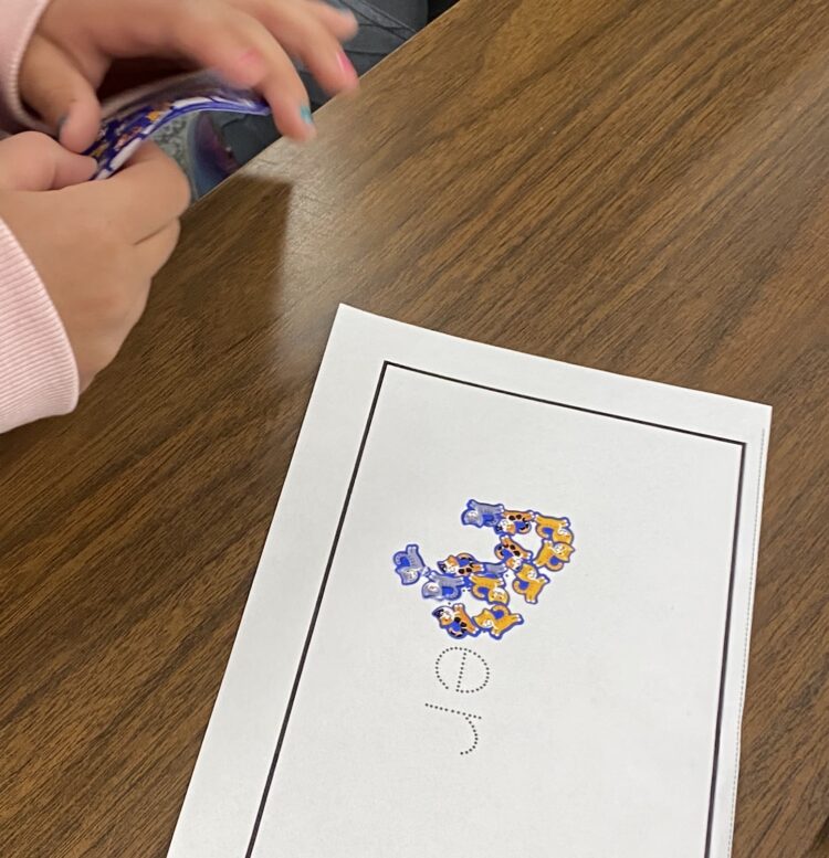 Tracing your name with stickers if a great fine motor activity.