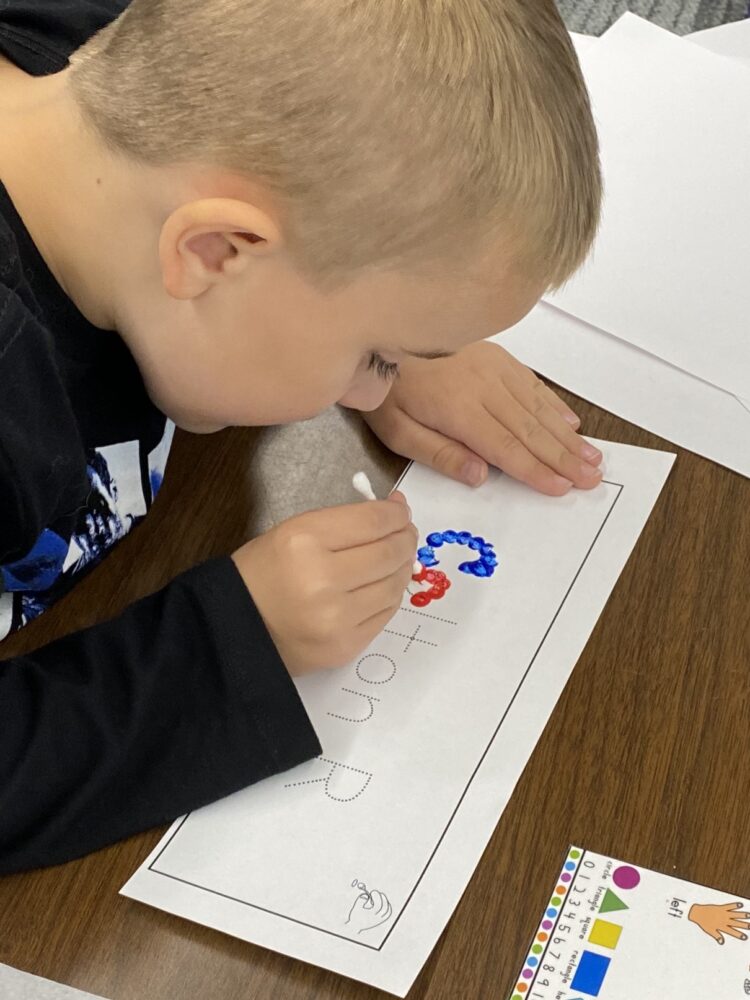 Name writing with q-tips.