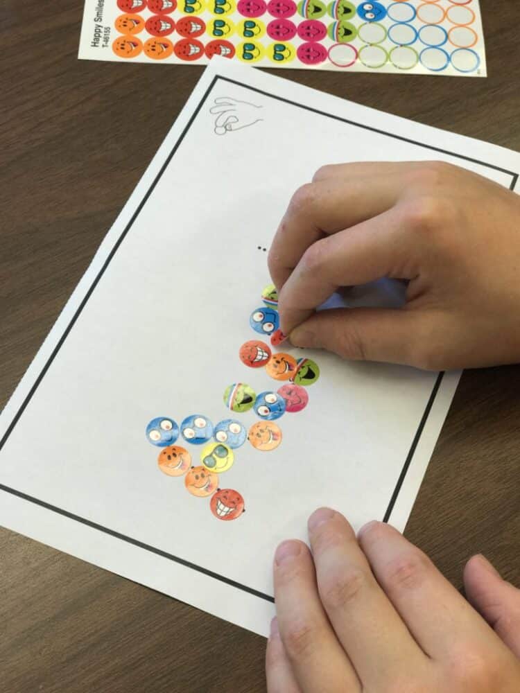 Writing names with stickers.